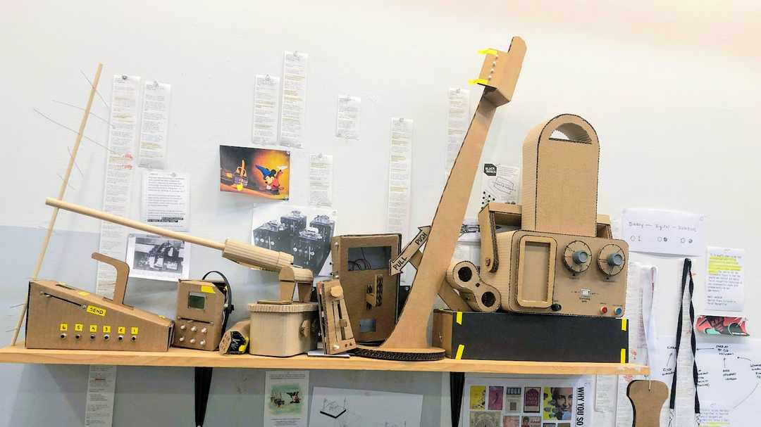 A shelf of cardboard prototypes of different data collection devices