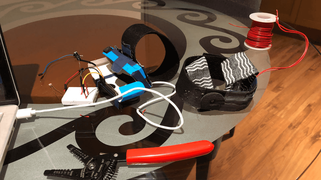 A circuit board and electronic tools ontop of a table