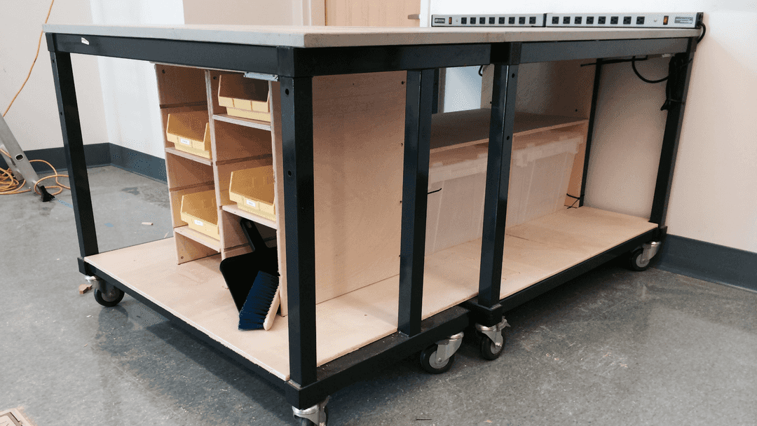 Wooden shelves built underneath a table.