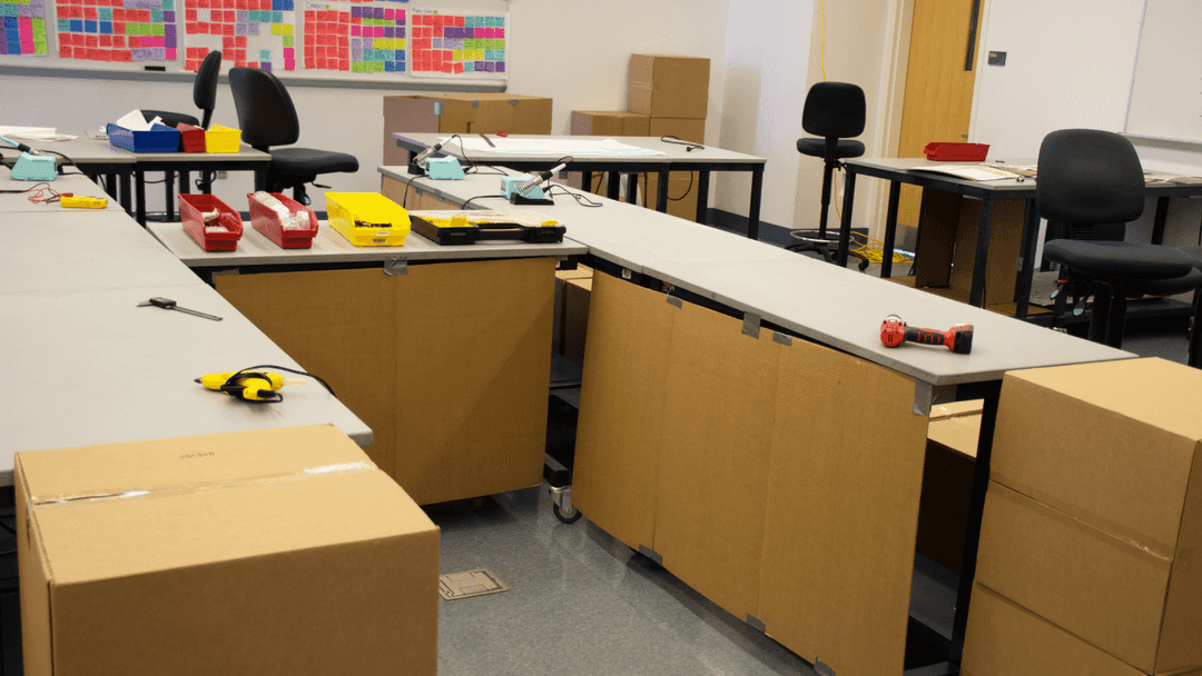 Prototype of a large table with tools scattered ontop of it